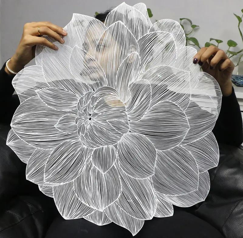 content_c1-Woman-holds-flower-papercut-artwork-by-Parth-Kothekar..jpg